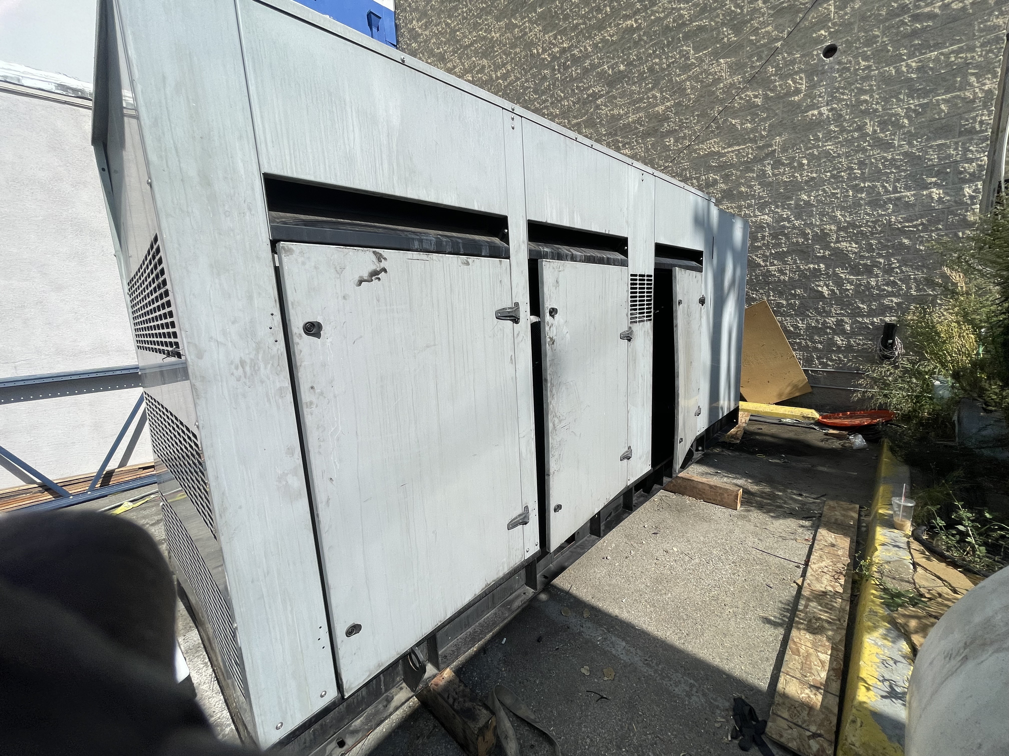 A large white box sitting on the side of a building